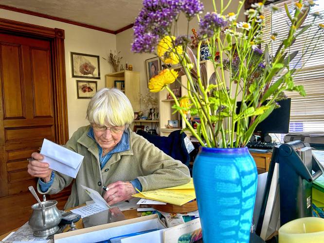 Barbara Filion writes letters for her loved ones at her dining table on a Thursday afternoon.