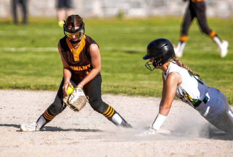 Bishop Brady baserunner Payton Bryson slides safely into second base after Conant shortstop Sophia Spingola bobbles the ball on Wednesday, May 29, 2024 at Rollins Park in Concord.