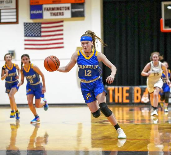 Franklin’s Kourtney Kaplan (12) goes on a fast break up the court during the opening round of the 44th Mike Lee Holiday Basketball Bash at Farmington High School. Kaplan and her teammates will be able to play their home games inside their own gym for the first time this season.