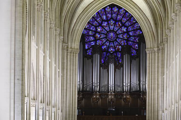A view of the Great Organ and the Western Rose window before the inaugural Mass, with the consecration of the high altar, at the Notre-Dame de Paris Cathedral, five-and-a-half years after a fire ravaged the Gothic masterpiece, as part of ceremonies to mark the Cathedral's reopening after its restoration, in Paris, France, Sunday, Dec. 8, 2024. (Sarah Meyssonnier/Pool Photo via AP)