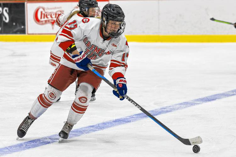 Concord’s Claire Brown (17) carries the puck up the ice during a game on Saturday at Everett Arena. Brown scored a goal to help Concord overcome a 2-0 deficit to defeat St. Thomas-Winnacunnet-Dover, 3-2, for the Tide's ninth consecutive victory.