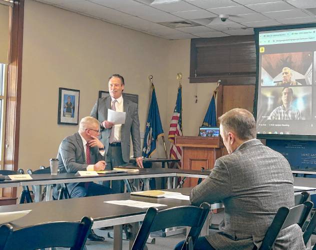 Former governor Craig Benson (center) kicks off the first public meeting of Kelly Ayotte’s new Commission on Government Efficiency on Wednesday as his co-chair, Andy Crews (left), and member Al Letizio Jr. look on.