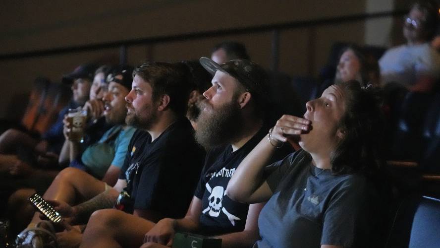 Movie patrons watch the presidential debate between President Joe Biden and Republican presidential candidate former President Donald Trump at Brewvies Cinema Pub on Thursday, June 27, 2024, in Salt Lake City. (AP Photo/Rick Bowmer)