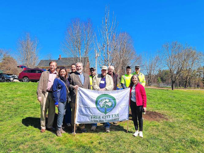 Jim Milliken (with cap) stands with Mayor Byron Champlin and the Concord City Coucil at the planting of another tree on Arbor Day this past Spring.