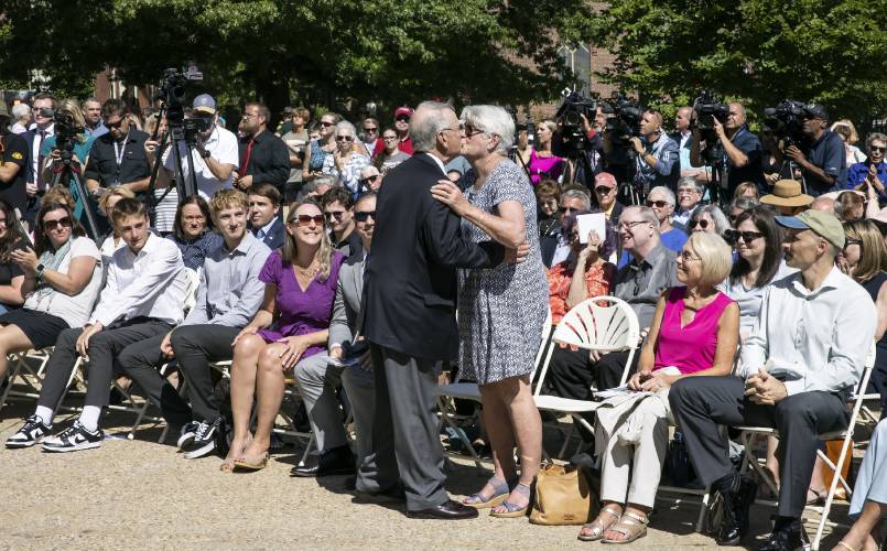 Steven McAuliffe gets a kiss from his wife, Kathy, as his family looks on after his speech Christa McAuliffe.