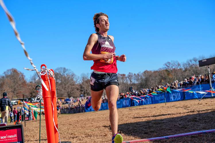 Concord’s Josiah Conley crosses the finish line in 15th-place that the 89th Annual New England Interscholastic Cross Country Championships at Wickham Park in Manchester, Conn., on Saturday.