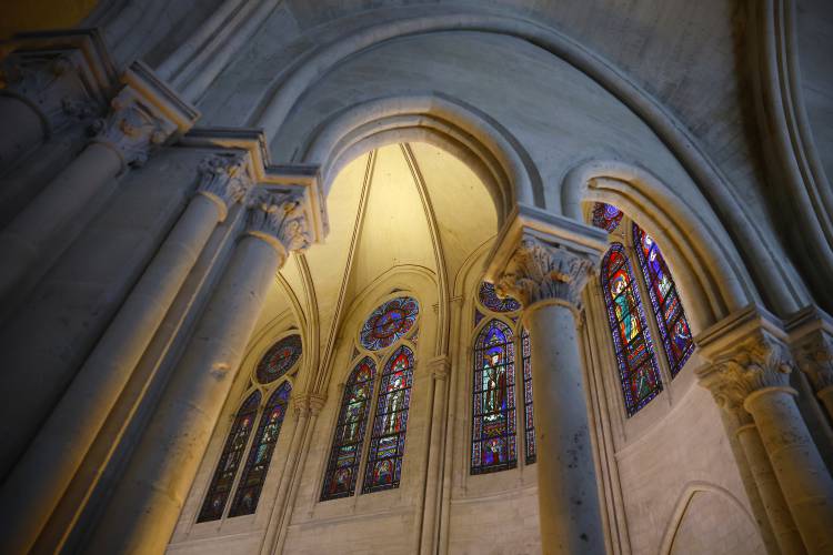A view of stained glass windows during an inaugural Mass, with the consecration of the high altar, at the Notre-Dame de Paris Cathedral, in Paris, France, Sunday, Dec. 8.