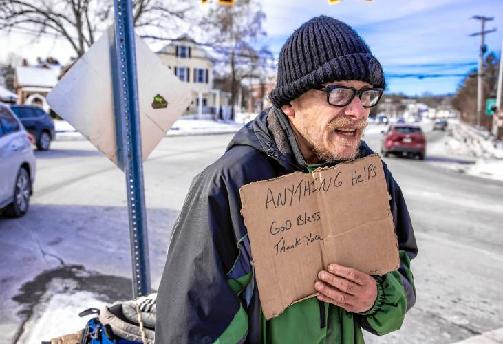 Raymond Blodgett asks for donations at the end of I-393 as it spills out into North Main Street in Concord on Tuesday, January 21, 2025. After hours in the cold, he had one donation of five dollars.