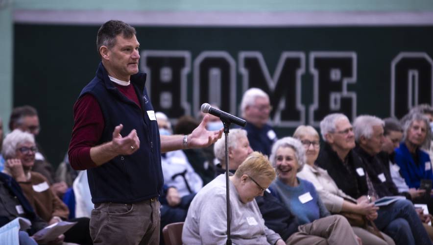 Hopkinton resident Steve Trafton asks about what is going on with Briar Hill Road as the town discusses article 3 at the town meeting on Saturday morning, March 18, 2023 at the Hopkinton High gym.
