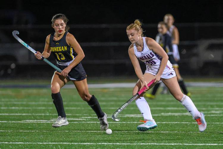 John Stark’s Lauryn Guevin keeps the ball away from Souhegan’s Sophia Merenda during Thursday’s D-II semifinal in Exeter. Guevin scored twice in a 4-1 victory. Guevin was named the Division II Offensive Player of the Year.