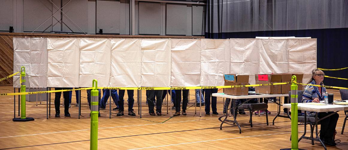 Voting booths are full at the Epsom Bible Church on Tuesday, March 12, 2024.