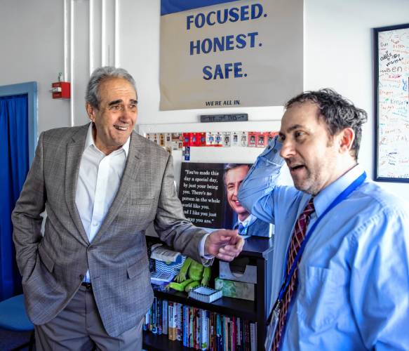 Former Franklin assistant principal Bill Athanas talks with the current principal David Levesque in his office on Monday, April 9.