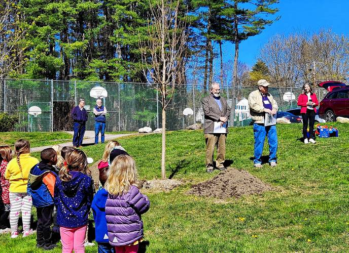 Jim Milliken (with cap) stands with Mayor Byron Champlin at the planting of another tree on Arbor Day this past Spring.