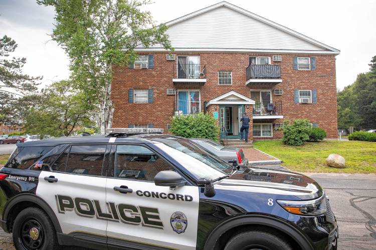 Concord police enter a Morningstar condo building to talk to witnesses after a stolen car was abandoned on Appleton Street and five individuals fled. Concord police enter a Morningstar condo building to talk to witnesses after a stolen car was abandoned on Appleton Street and five individuals fled.