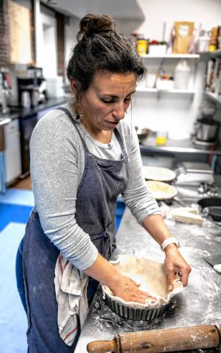 Chelsea Annett forms dough to make quiche crusts in her kitchen at Table on Wednesday, November 20, 2024. Annett opened Table, located in Concord’s Eagle Square, in July.