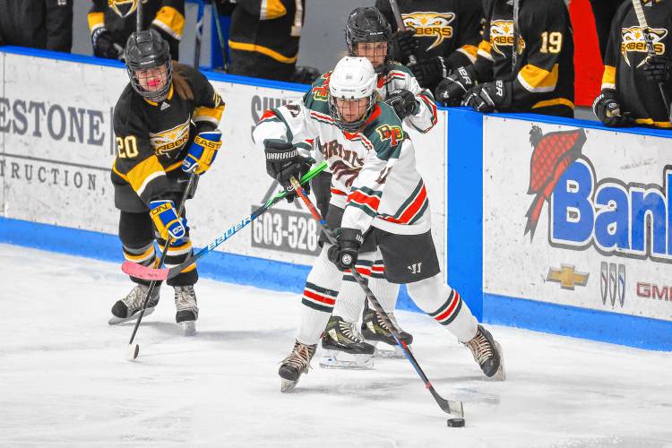 Senior defender and captain Meghan Schmidt (11) scored one goal and provided three assists while locking down Souhegan’s attacks on Monday night. Bishop Brady-Trinity-Bow won, 8-0.