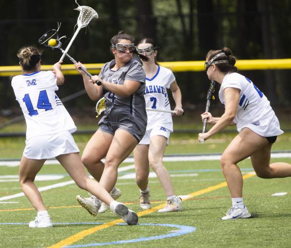 Merrimack Valley senior attacker Alyssa Brodeur gets ready to shoot surrounded by Merrimack players in the second half of the Division II semifinals on Sunday. MV won, 13-10, to advance to its first-ever girls’ lacrosse state championship.