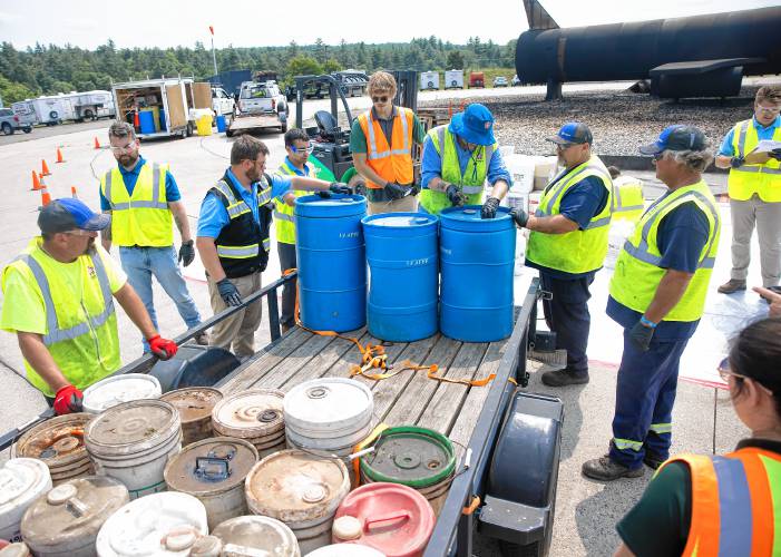 Workers from Revive Enviromental and Republic Services open up containers from the Allenstown Fire Department to inspect them for PFAS compounds in the AFFF that they might have during the drop off at Take Back Program at Smokey Bear Boulevard in Concord on Tuesday. Workers from Revive Enviromental and Republic Services open up containers from the Allenstown Fire Department to inspect them for PFAS compounds in the AFFF that they might have during the drop off at Take Back Program at Smokey Bear Boulevard in Concord on Tuesday.