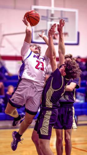 Pittsfield guard Brayden Pelletier goes up for a shot against Portsmouth Christian Academy on Tuesday night.