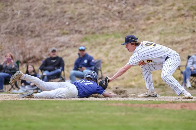 Bow first baseman Jake Reardon (right) applies a tag to a Pelham baserunner during a game on Friday at Bow High School. Bow beat Pelham, 3-1.