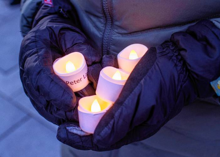 Some of the electronic candles with names of the homeless persons who died in 2023.