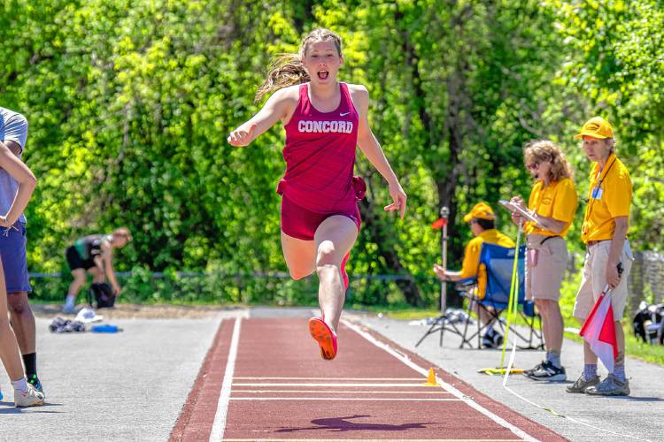 Concord’s Ella Goulas competes in the triple jump at the NHIAA Division I track and field championships at Portsmouth High School on Saturday. Goulas won the triple jump title with a leap of 36 feet, 11.5 inches, and also finished third in the high jump and long jump to lead the Concord girls to third as a team.