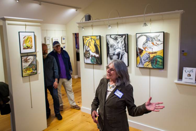 Russet Jennings talks about her garden drawings and her element, earth, during a reception and artist's talk for the exhibit 