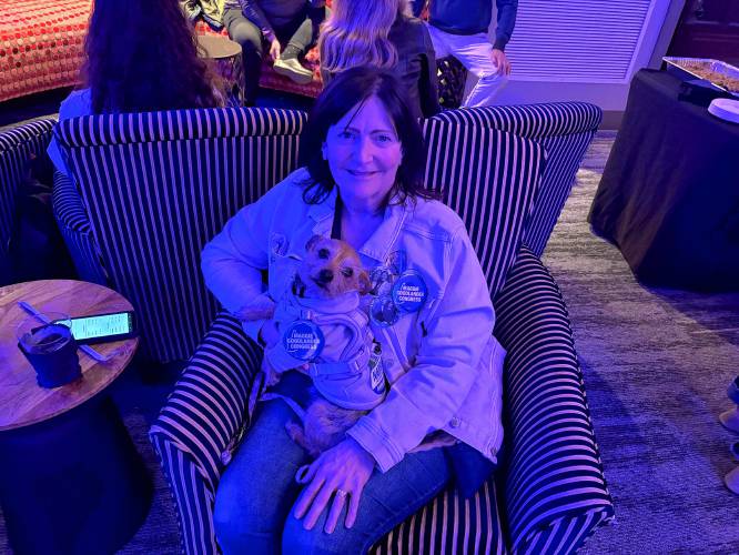 Thalia Floras and her dog Lucy celebrated Maggie Goodlander’s candidacy in Concord on Election Day. 