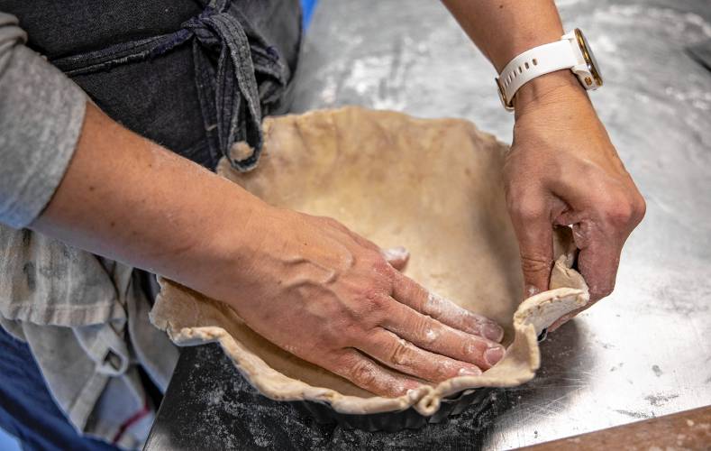 Chelsea Annett forms a pie crust in her kitchen at Table on Wednesday, November 20, 2024. Annett opened Table, located in Concord’s Eagle Square, in July.
