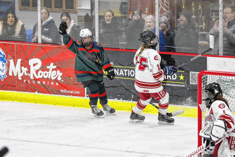 Brinity-Bow sophomore Kaylee Jacques (left) celebrates the completion of her three-goal hat trick that secures a 3-2 win over Concord on Wednesday night at Everett Arena.