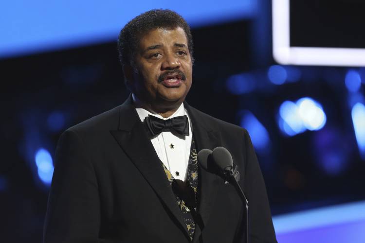Neil deGrasse Tyson speaks at the 60th annual Grammy Awards at Madison Square Garden on Sunday, Jan. 28, 2018, in New York. (Photo by Matt Sayles/Invision/AP) Neil deGrasse Tyson speaks at the 60th annual Grammy Awards at Madison Square Garden on Sunday, Jan. 28, 2018, in New York. (Photo by Matt Sayles/Invision/AP)