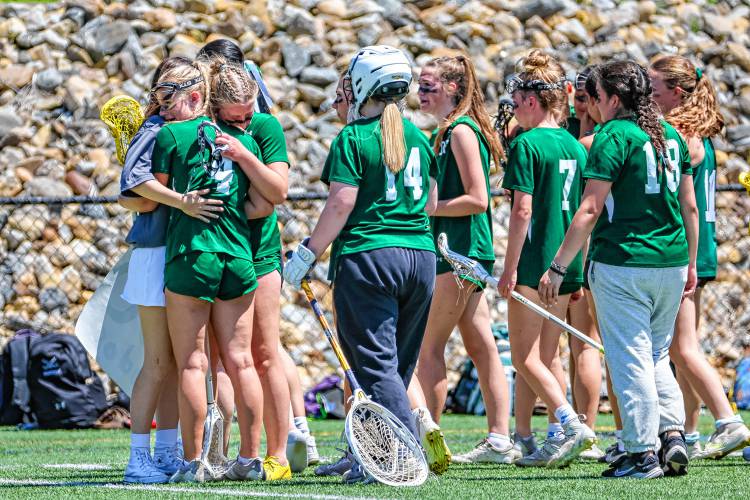 Hopkinton walks off the field for the final time this season after a 19-8 loss to No. 1 St. Thomas in the Division III girls' lacrosse semifinals at Laconia High School on Saturday, June 1, 2024.