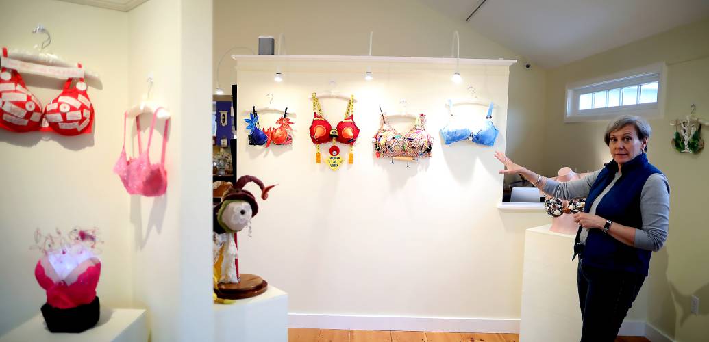 Twiggs Gallery Manager Laura Morrison with some of the items for the âBusting Out: Powerful Women,â exhibit that opened Saturday at Twiggs Gallery in Boscawen.