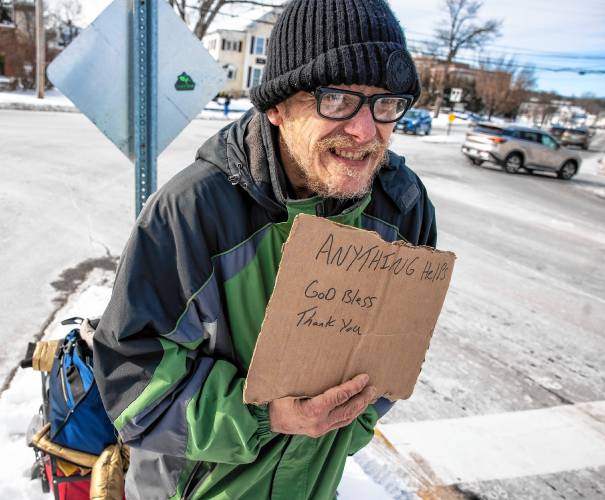Raymond Blodgett asks for donations at the end of I-393 as it spills out into North Main Street in Concord on Tuesday, January 21, 2025. After hours in the cold, he had one donation of five dollars.