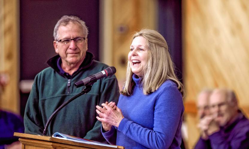 Jocelyn Carlucci, along with her husband Dana, thanks the crowd at the Pembroke Town Meeting as the couple were named citizens of the year at the beginning of the day.
