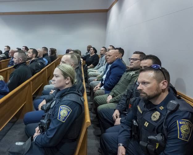 Law enforcement sit at the trial of Adam Montgomery at Hillsborough County Superior Court, Thursday, Feb. 22, 2024, in Manchester, N.H. Adam Montgomery has been convicted of second-degree murder in the death of his 5-year-old daughter. Police believe Harmony Montgomery was killed nearly two years before she was reported missing in 2021. (Jeffrey Hastings/Pool Photo via AP)