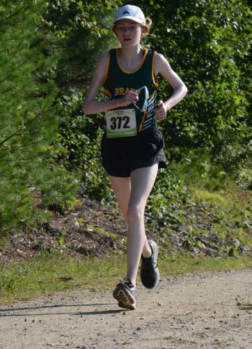 Bishop Brady’s Eloise Burns races at the Gilford Early Bird Invitational at Gunstock on Thursday. Burns finished 10th out of 87 runners, the top area competitor at the meet. Bishop Brady’s Eloise Burns races at the Gilford Early Bird Invitational at Gunstock on Thursday. Burns finished 10th out of 87 runners, the top area competitor at the meet.
