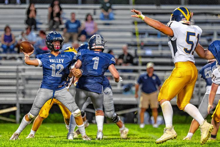 Merrimack Valley’s junior quarterback, Jack Parris (10), throws a pass to a teammate on Friday night. Parris made big plays to keep the Pride in the game, but was constantly under-pressure by Bow defensive end Jackson Hall (51) in a 23-13 loss.