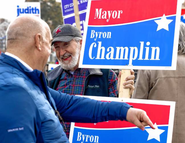 Mayor Jim Bouley talks with mayoral candidate Byron Champlin at the Ward 5 polling place at Christa McAuliffe Elementary on Tuesday, November 7, 2023.