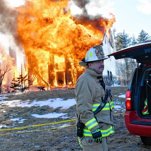 A fire that began in the garage quickly spread to the entirety of a four-bedroom home on Barton Corner Road in Hopkinton on Wednesday. A woman and two dogs were able to evacuate, according to Hopkinton Fire Department, but the home was destroyed.