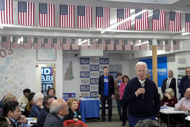President Joe Biden speaks to supporters during a visit to a campaign field office, Monday, March 11, 2024, in Manchester, N.H. (AP Photo/Evan Vucci) 