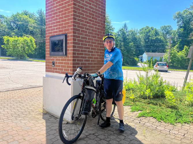 Bob Sanders stops at the Concord Monitor before setting off on 700-mile bike tour to protest the war in Gaza.