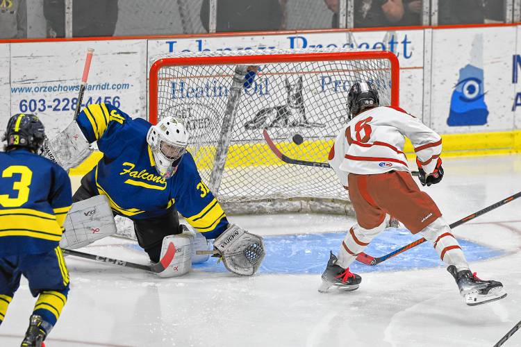 Concord’s Rowan Arndt (18) shoots the puck into the open net for a during the second period of a game against Bow at Everett Arena on Wednesday. Concord won 5-0.