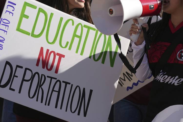 FILE - Students march at Arizona State University in protest of ASU's chapter of College Republicans United-led event encouraging students to report FILE - Students march at Arizona State University in protest of ASU's chapter of College Republicans United-led event encouraging students to report
