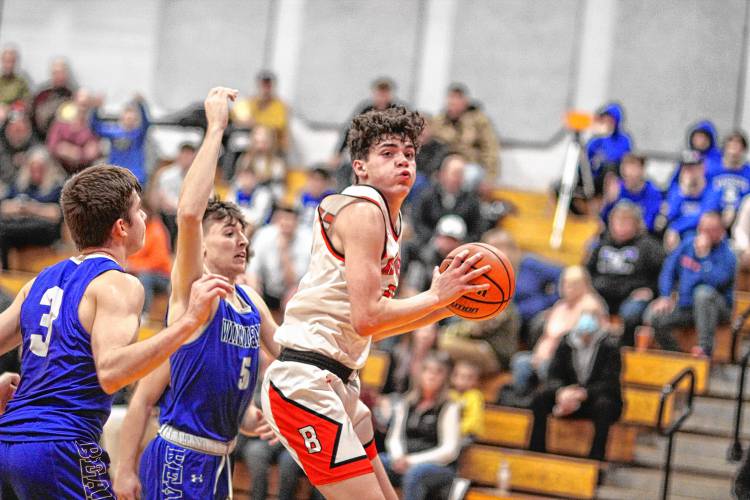 Keegan Martinez prepares to put up a shot in a game against Winnisquam last January. Martinez and fellow-junior Anakin Underhill have led the way for Belmont's offense this season.