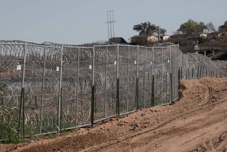 Fences lined with concertina wire along the banks of the Rio Grande River in Shelby Park in Eagle Pass, Texas on Friday, Feb. 23.