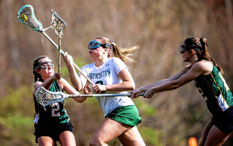 Hopkinton midfielder Autumn Meier powers through Bishop Brady players on Friday, May 3.