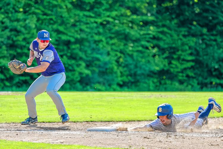 Bow's Colby Smith dives back into first base after a pickoff attempt during a 4-0 win over Milford in the first round of the playoffs on Thursday, May 30, 2024.