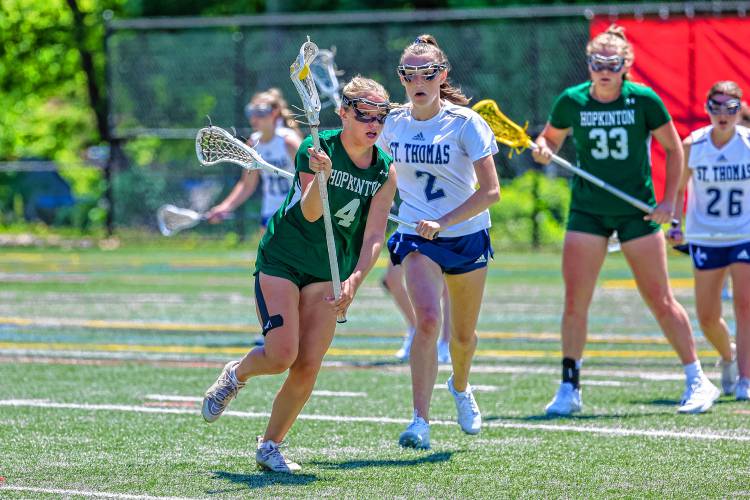 Hopkinton's Sarah Chodosh looks for an opening to score during the Hawks' 19-8 loss to St. Thomas in the Division III semifinals on Saturday, June 1, 2024.