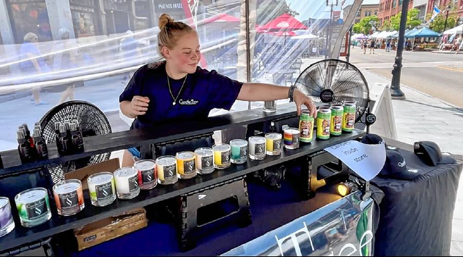 Autumn Hopler shows the soy candles made just for Market Days